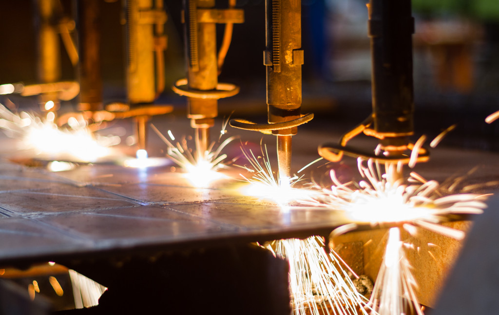 laser cutting machines working on a metal surface