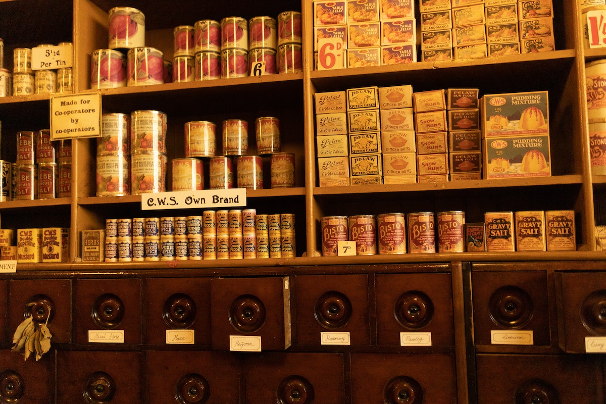 Vintage Wooden Cupboard with Vintage Cans and Boxes